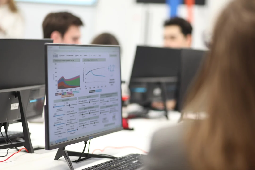 A flat lay of branding elements with color palettes and strategic planning documents on a concrete surface.